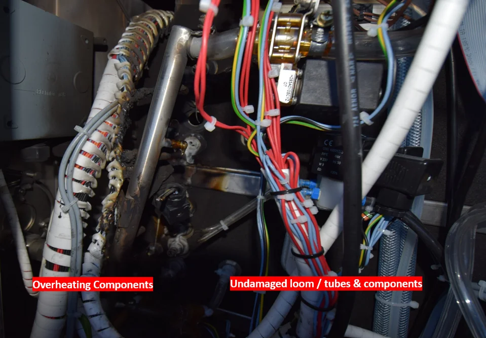 Inside the machine after fire 2: overheating components contained, surrounding wiring loom and tubes undamaged
